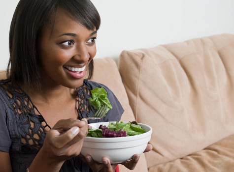 woman eating salad - Home
